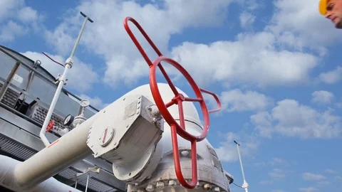 15 0516 2 Clouds WorkerOpensValveCloseup Stock Footage 105462266