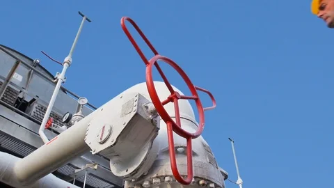 15 0516 3 Sky WorkerOpensValveCloseup Stock Footage 105462322