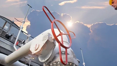 15 0516 5 Sunset WorkerOpensValveCloseup Stock Footage 105462452