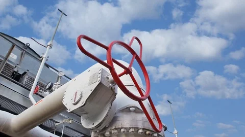 15 0517 2 Clouds WorkerClosesValveCloseup Video stock 105462827