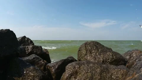 (15 sec)  Waves over the stones in Stavoren 1 Stockbeeldmateriaal 206671114