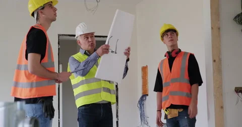 15 Team Of Construction Workers And Engineer In New House Stock Footage 162848608