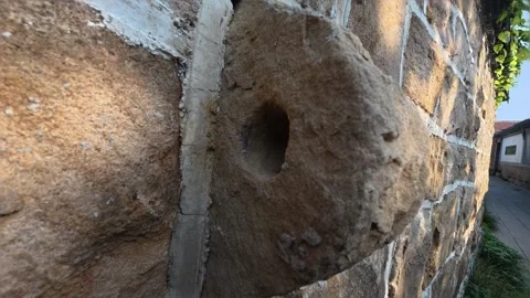15 Weathered stone wall with hole , Shandong, China, 21 Jan 2026 Stock Footage 345885360