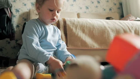 1,5 year-old child playing with educational cup toys at home. Stock Footage 107062490
