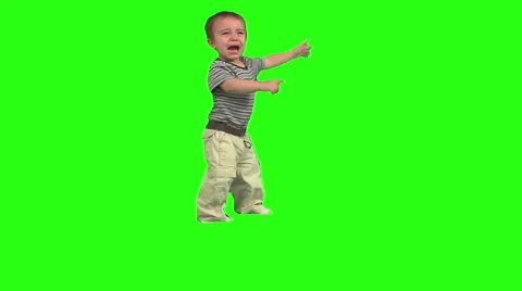1.5 year old crying. Day clothes. Green background. Standing Stock Footage 49864412