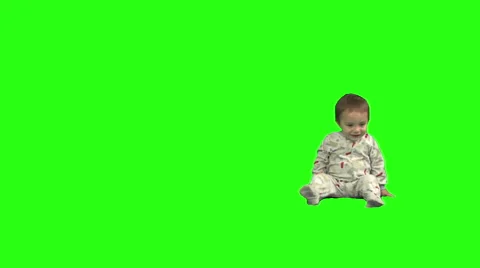 1.5 year old sits, stands, and walks offscreen left. Stock Footage 49864481