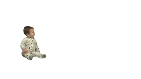 1.5 year old sits, stands, and exits screen right. Stock Footage 49864484