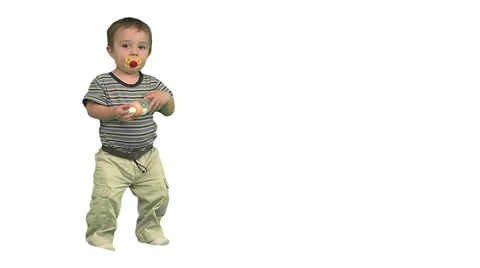 1.5 year old standing then drinks from bottle. White background. Stock Footage 49864403