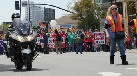$15.00 per hour crowd of protesters and police in the street in San Diego Stock Footage 62404577