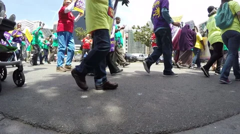 $15.00 per hour crowd of protesters shot of feet walking Stock-Footage 62377325