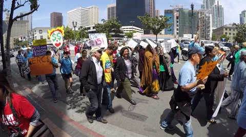 $15.00 per hour crowd of protesters walking by in San Diego Stock Footage 62377773