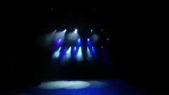 Free stage with blue lights, lighting devices, smoke fog.