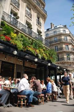 PARIS,  FRANCE  -  Apr  24,  2008:  People  sitting  densely  packed  in  garden  of  famous  Cafe  de  Flore  in  Paris,  France xkwx city,  urban,  capital,  france,  french,  cafe,  bistro,  famous,  tourism,  travel  destination,  garden,  restaurant,  cafe  de  flore,  people,  sitting,  drinking,  eating,  densley  packed