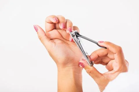 Close  up  young  Asian  woman  have  tool  cutting  nails  fingernails  on  finger  using  a  nail  clipper.  Female  using  tweezers  by  herself,  studio  shot  isolated  on  white  background,  Healthcare  concept xkwx nail,  clipper,  clip,  cut,  fingernail,  human,  hand,  shorten,  woman,  trim,  finger,  tool,  toenails,  healthcare,  adult,  hands,  fingers,  people,  girl,  healthy,  accessory,  female,  isolated,  cutout,  clean,  instrument,  clippers,  health,  young,  thai,  asian,  care,  beauty,  manicure,  closeup,  hygiene,  scissors,  person,  stainless,  steel,  body,  cosmetics,  skin,  object,  trimmer,  metal,  trimming,  beautiful,  equipment,  white