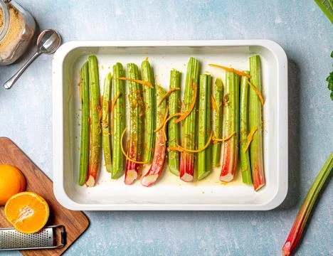 A  closeup  shot  of  rhubarb  stalks  in  a  rectangle  plate.  Top  view. xkwx closeup,  rhubarb,  stalks,  stems,  food,  fresh,  vegetarian,  top,  view,  organic,  cooked,  meal,  dish,  dinner,  cuisine,  delicious,  prepared,  healthy,  plant,  vitamin,  ingredient,  edible,  green,  species,  colors