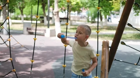 1579A child blows soap bubbles. Stock Footage 302800056