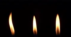 Close up candle fire flame isolated burning on black background, slow motion 4K