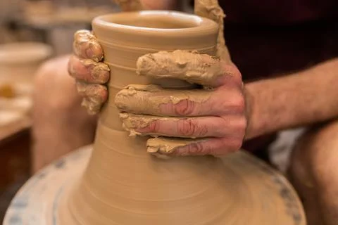 Crop unrecognizable sculptor with equipment giving shape while sculpting with brown clay on throwing wheel xkwx man, shape, clay, sculpt, equipment, process, motion, jug, ceramic, skill, male, sculptor, workshop, art, artist, handicraft, earthenware, ceramist, craft, create, dirty, form, hobby, handmade, maker, master, molding, occupation, pottery, utensil, wet, wheel, professional, work, artisan, throw, small business, talent, workplace, crop, unrecognizable, faceless, anonymous, horizontal, body part, blur, indoors