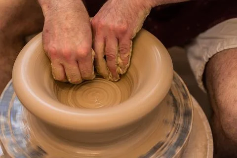 Crop unrecognizable sculptor with equipment giving shape while sculpting with brown clay on throwing wheel xkwx man, shape, clay, sculpt, equipment, process, motion, jug, ceramic, skill, male, sculptor, workshop, art, artist, handicraft, earthenware, ceramist, craft, create, dirty, form, hobby, handmade, maker, master, molding, occupation, pottery, utensil, wet, wheel, professional, work, artisan, throw, small business, talent, workplace, crop, unrecognizable, faceless, anonymous, horizontal, body part, blur, indoors, top view, from above