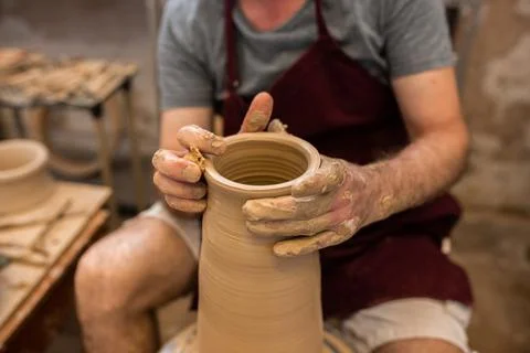 Crop unrecognizable sculptor with equipment giving shape while sculpting with brown clay on throwing wheel xkwx man, shape, clay, sculpt, equipment, process, motion, jug, ceramic, skill, male, sculptor, workshop, art, artist, handicraft, earthenware, ceramist, craft, create, dirty, form, hobby, handmade, maker, master, molding, occupation, pottery, utensil, wet, wheel, professional, work, artisan, throw, small business, talent, workplace, crop, unrecognizable, faceless, anonymous, horizontal, body part, blur, indoors