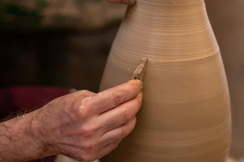 Crop unrecognizable sculptor with equipment giving shape while sculpting with brown clay on throwing wheel xkwx man, shape, clay, sculpt, equipment, process, motion, jug, ceramic, skill, male, sculptor, workshop, art, artist, handicraft, earthenware, ceramist, craft, create, dirty, form, hobby, handmade, maker, master, molding, occupation, pottery, utensil, wet, wheel, professional, work, artisan, throw, small business, talent, workplace, crop, unrecognizable, faceless, anonymous, horizontal, body part, blur, indoors
