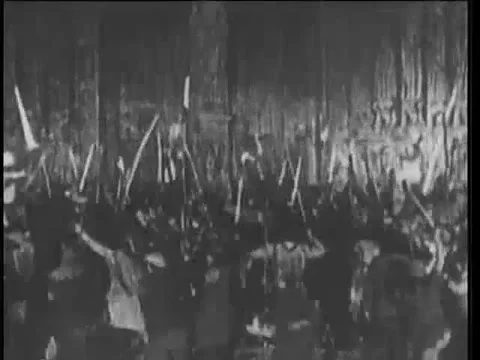 15th century reenactment of  angry mob attacking soldiers on horseback, 1920s Stock Footage