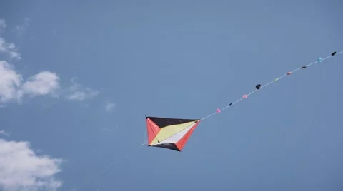 16-Colorful Kite Flying In The Blue Sky Slowmotion Stock Footage