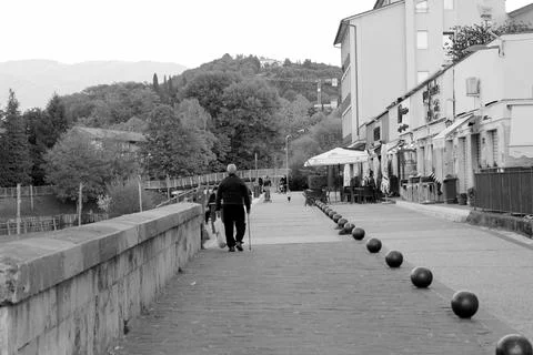 16 October 2017 - Rieti - Elderly man walking alone in a street Stock Photos