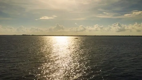 16 second video ocean horizon boat sailing in sunset reflection on water Stock Footage 96518413