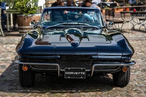 DIEDERSDORF,  GERMANY  -  AUGUST  21,  2021:  The  sports  car  Chevrolet  Corvette  Sting  Ray  Convertible  (C2),  1964.  The  exhibition  of  "US  Car  Classics". xkwx america,  american,  ancient,  antique,  auto,  automobile,  automotive,  car,  classic,  design,  diedersdorf,  exhibition,  germany,  machine,  model,  nostalgia,  old,  oldtimer,  retro,  style,  transport,  transportation,  us,  usa,  vehicle,  vintage,  exterior,  2-door,  sports  car,  Chevrolet,  Corvette,  Sting  Ray,  Convertible,  C2,  second  generation,  GM,  General  Motors,  black,  muscle  car
