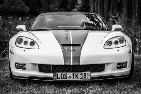DIEDERSDORF,  GERMANY  -  AUGUST  21,  2021:  The  sports  car  Chevrolet  Corvette  Grand  Sport  Convertible.  Black  and  white.  The  exhibition  of  "US  Car  Classics". xkwx power,  technology,  performance,  modern,  2-door,  america,  american,  ancient,  antique,  auto,  automobile,  automotive,  black,  c6,  cabrio,  cabriolet,  car,  chevrolet,  classic,  convertible,  corvette,  design,  diedersdorf,  engine,  exhibition,  front,  general  motors,  germany,  gm,  grand  sport,  machine,  model,  muscle  car,  nostalgia,  old,  oldtimer,  retro,  sports  car,  style,  transport,  transportation,  us,  usa,  vehicle,  white