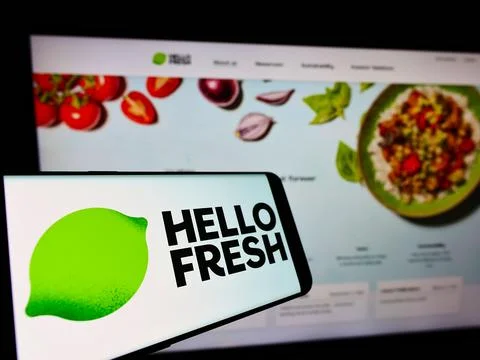STUTTGART, GERMANY - Sep 12, 2021: Cellphone with logo of German meal-kit company HelloFresh SE on screen in front of business website. Focus on center-right of phone display. xkwx delivery, company, dax, fresh, food, hellofresh, logo, germany, background, berlin, brand, business, cellphone, computer, cooking, display, front, german, homepage, illustrative editorial, internet, kit, meal, monitor, online, pre-portioned, public, screen, se, selective focus, service, smartphone, stock, subscription, trademark, website, hello, advertisement, marketing