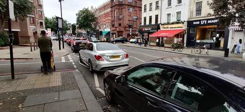 25  SEPTEMBER  2021  -  LONDON  ENGLAND  UNITED  KINGDOM:  LONG  LINE  OF  CARS  QUEUE  FOR  FUEL  AS  A  SHORTAGE  OF  LORRY  DRIVERS  DISRUPTS  FUEL  DELIVERIES,  CAUSING  PEOPLE  TO  PANIC  BUY. xkwx panic  buying  petrol,  london,  UK,  petrol  stations,  FUEL  crisis,  lorry  drivers,  news,  journalism,  editorial,  image