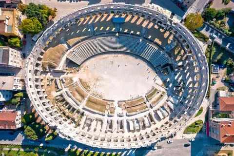 Arena  Pula.  Ancient  ruins  of  Roman  amphitheatre  in  Pula  aerial  view,  Istria  region  of  Croatia xkwx pula,  istra,  istria,  arena,  statue,  landmark,  tourism,  tourist,  destination,  architecture,  roman,  amphitheatre,  amphitheater,  italian,  ancient,  travel,  old,  europe,  view,  monument,  european,  town,  arch,  theater,  stadium,  beautiful,  landscape,  history,  facade,  vacation,  coliseum,  unesco,  city,  stone,  building,  historical,  heritage,  street,  medieval,  amphiteatre,  square,  amphiteater,  theatre,  arcade,  detail,  church,  tower,  aerial