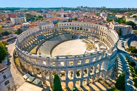 Arena  Pula.  Ancient  ruins  of  Roman  amphitheatre  in  Pula  aerial  view,  Istria  region  of  Croatia xkwx pula,  istra,  istria,  arena,  statue,  landmark,  tourism,  tourist,  destination,  architecture,  roman,  amphitheatre,  amphitheater,  italian,  ancient,  travel,  old,  europe,  view,  monument,  european,  town,  arch,  theater,  stadium,  beautiful,  landscape,  history,  facade,  vacation,  coliseum,  unesco,  city,  stone,  building,  historical,  heritage,  street,  medieval,  amphiteatre,  square,  amphiteater,  theatre,  arcade,  detail,  church,  tower,  aerial