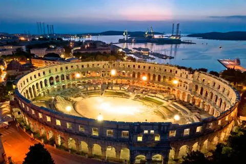 Arena  Pula.  Ancient  ruins  of  Roman  amphitheatre  in  Pula  aerial  evening  view,  Istria  region  of  Croatia xkwx pula,  istra,  istria,  arena,  statue,  landmark,  tourism,  tourist,  destination,  architecture,  roman,  amphitheatre,  amphitheater,  ancient,  travel,  old,  europe,  view,  monument,  european,  town,  arch,  theater,  stadium,  beautiful,  landscape,  history,  facade,  vacation,  coliseum,  unesco,  city,  stone,  building,  historical,  heritage,  medieval,  amphiteatre,  square,  amphiteater,  theatre,  arcade,  detail,  church,  tower,  aerial,  evening,  night