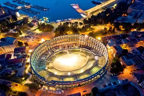 Arena  Pula.  Ancient  ruins  of  Roman  amphitheatre  in  Pula  aerial  evening  view,  Istria  region  of  Croatia xkwx pula,  istra,  istria,  arena,  statue,  landmark,  tourism,  tourist,  destination,  architecture,  roman,  amphitheatre,  amphitheater,  ancient,  travel,  old,  europe,  view,  monument,  european,  town,  arch,  theater,  stadium,  beautiful,  landscape,  history,  facade,  vacation,  coliseum,  unesco,  city,  stone,  building,  historical,  heritage,  medieval,  amphiteatre,  square,  amphiteater,  theatre,  arcade,  detail,  church,  tower,  aerial,  evening,  night