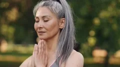 Close-up view of confident woman meditating