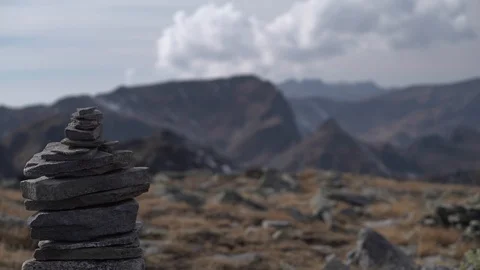 1665. Rock Pyramid with Massive Mountain Range Background 4K Stock Footage 88732731