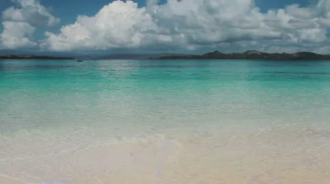 167  White sand beach, waves and cloudscape. Video stock 22874418