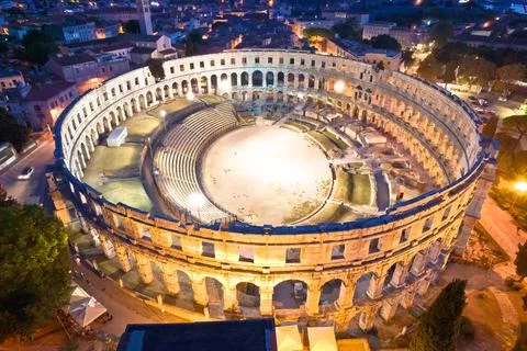 Arena  Pula.  Ancient  ruins  of  Roman  amphitheatre  in  Pula  aerial  evening  view,  Istria  region  of  Croatia xkwx pula,  istra,  istria,  arena,  statue,  landmark,  tourism,  tourist,  destination,  architecture,  roman,  amphitheatre,  amphitheater,  ancient,  travel,  old,  europe,  view,  monument,  european,  town,  arch,  theater,  stadium,  beautiful,  landscape,  history,  facade,  vacation,  coliseum,  unesco,  city,  stone,  building,  historical,  heritage,  medieval,  amphiteatre,  square,  amphiteater,  theatre,  arcade,  detail,  church,  tower,  aerial,  evening,  night