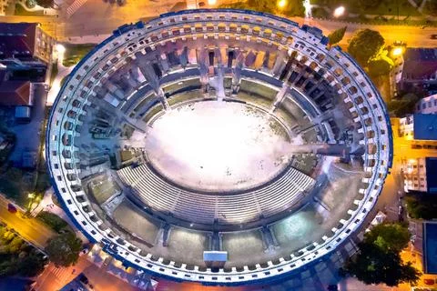 Arena  Pula.  Ancient  ruins  of  Roman  amphitheatre  in  Pula  aerial  evening  view,  Istria  region  of  Croatia xkwx pula,  istra,  istria,  arena,  statue,  landmark,  tourism,  tourist,  destination,  architecture,  roman,  amphitheatre,  amphitheater,  ancient,  travel,  old,  europe,  view,  monument,  european,  town,  arch,  theater,  stadium,  beautiful,  landscape,  history,  facade,  vacation,  coliseum,  unesco,  city,  stone,  building,  historical,  heritage,  medieval,  amphiteatre,  square,  amphiteater,  theatre,  arcade,  detail,  church,  tower,  aerial,  evening,  night