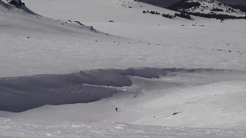 1687. Winter Mountain Hiker Down the Hill 4K Stock Footage 88734447