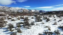 Beautiful Aerial View of Snowy Mountains and Bushes in Bluffdale Utah -