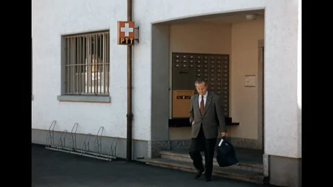 16MM - man bringing mail back home from the Po Box - 1957 - Switzerland 스톡 동영상 94180074