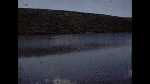 16mm pan of river Stock Footage 129851385