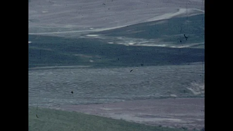 16mm slow pan undeveloped landscape Video stock 129851483