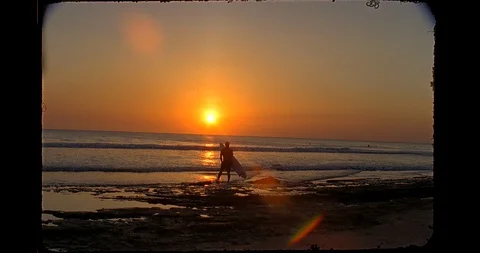 16mm-sunset surfer Stock Footage 128409473