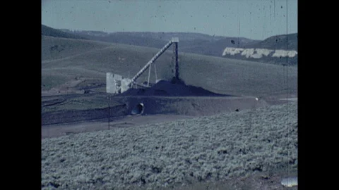 16mm zoom in on surface mining tower Stock Footage 129851357