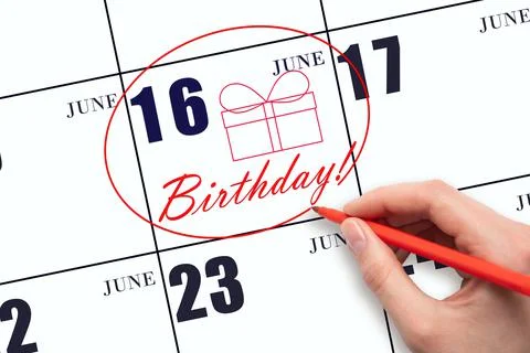 16th day of June. The hand circles the date on the calendar 16 June, draws a  Stock Photos